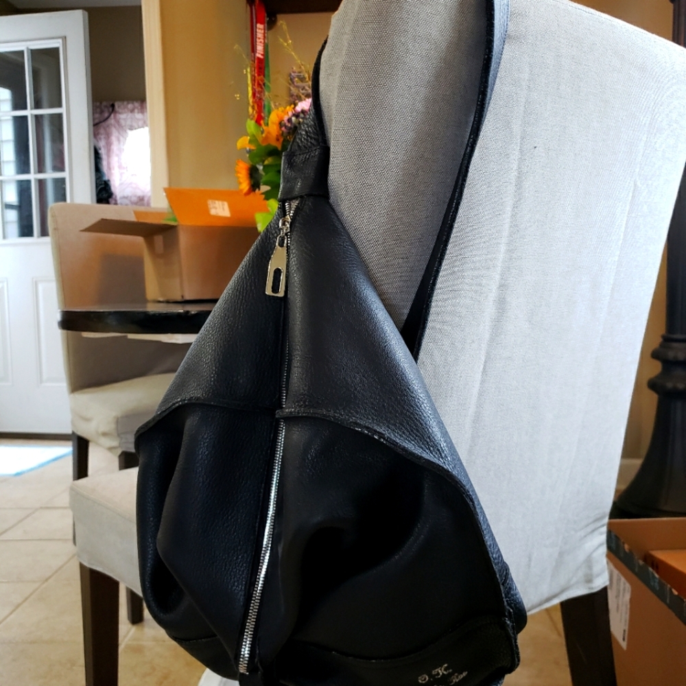 Stunning over shoulder genuine leather handmade bag. Designer stamped